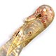 This bookmark was made in either France or England. It is made of mother of pearl and is in the shape of a shrimp.