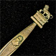 This bookmark was made in France by an unknown manufacturer. It is unmarked and is made of brass. The top is a figural lion and the top blade has a bust of Napoleon. Under the lion it is inscribed XVIII JUNI MDCCCCXV, the date the Battle of Waterloo started