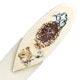 This bookmark is either bone or ivory. It has hand painted flowers and musical instruments on the top. It is American made by an unknown manufacturer sometime in the 1930's.