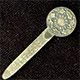 This bookmark was made in the US by an unknown manufacturer. The top is a a holly plant and says Merry Christmas. The blade says Bickelmann Schenectady.