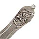 This bookmark was manufactured in the US. It is marked Sterling 925/1000. The manufacturer is unknown. The top has a relief flower in the victorian style which dates it between 1900 and 1920.