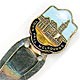 This bookmark is made in Australia. The top part of the bookmark is an enamel on brass picture of the Town Hall Melbourne. The blades are not silver. It is marked Pitcher Melb. on the back. The date is unknown.
