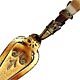 This bookmark is made in Scotland. It is a brass trowel with a Carnelian handle surrounded by a brass snake. The date is unknown.