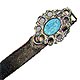 This bookmark is made in the US. It is probably new judging by the look of the silver. The top is an blue enamel of a woman surrounded by a silver design. It is marked only sterling on the back.