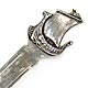 This bookmark was made in Norway probably in the 1920s. It is marked 830s and something else. The top is a Viking ship.
