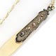 This bookmark was made in France between 1890 and 1900. It is made of celluloid and some silver metal possibly pewter or aluminum. It is signed "Offner" by the artist.