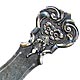 This bookmark was made in Norway and imported into Sweden. It is marked with the Swedish import marks and the letter S. It is also marked Norge. The top is an art nouveau with flowers. The date is 1910 - 1920.