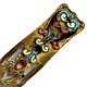This bookmark was made in Austria. It is gilt bronze with champleve enamel work on the top blade. The bottom blade is a cutout design of flowers and leaves. The date is 1890 - 1900.