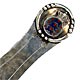 This bookmark was made in Norway. It is marked BH 830S and has both blades hand hammered. The top has a royal crest in enamel. The date is 1920 - 1930.