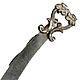 This bookmark was made in the US by an unknown manufacturer. It is marked only Sterling and is in the shape of a sword with two lion heads at the top. The date is 1900 1910.