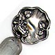 This bookmark was made in the US by an unknown manufacturer. It is marked only sterling on the front. The top is an art nouveau design of a lily pod and flower. The date is 1900 - 1910.