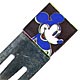 This bookmark was made in the US by Acme. It is an enamel and silver plate bookmark with a reproduction of an Andy Warhol picture of Mickey Mouse. The back is marked with a signature of Andy Warhol, Acme and &copy 1994 AWF.