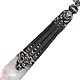 This bookmark was made in France circa 1890 - 1900. It is  made of silver with mother of pearl blades. The silver has an art nouveau design. The silver is unmarked.