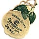  This bookmark was made in the US and is a celluloid advertisement for the Penna. State Convention. It is probably more of a hang tag than a bookmark. It has a picture of green leaves on the top and a faded gray rose as the background. The date is 1894.   
