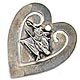  This bookmark was made in the US by Daniel Low & Co. It is marked Sterling on the back and has the famous Witch symbol on the smaller inner blade on the front. It is in the shape of a heart. The date is 1900 - 1910. 