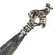 This bookmark was probably made in a South American country between 1920 and 1930. It is marked 900 with some kind of hallmark. It is a figural of a cowboy riding a bucking horse.