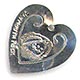  This bookmark was made in the US by an unknown manufacturer. It is marked only Sterling and is in the shape of a heart. The center blade has an engraving of Plymouth Rock and the date 1620. The date is 1930 - 1950.  