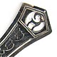  This bookmark was made in the US by an unknown manufacturer. It is completely unmarked but is believed to be silver. It has a figural of a long horn goat at the top. The center blade is inscribed MMB. The date is 1920 - 1930.  