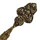  This bookmark was made in France circa 1900. It is made of brass or bronze and has a very ornate top part. The top blade has a figural cathedral and the word "Reims" inscribed under it.  