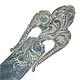 This bookmark was made in the US by George W. Shiebler & Co. It is marked with the makers hallmark, sterling and the number 2635. The top is an art nouveau design of a fleur de lis. The date is 1891 - 1910. 