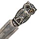 This bookmark was made in Germany between 1900 - 1910. It is marked Sterling 935. The back is inscribed "With compliments of the Bristol Hotel Berlin". The top is a figural of an owl with glass eyes.