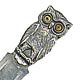 This bookmark was made in Denmark between 1910 - 1920. It is marked 830S and has an unidentifed hallmark. The top is a figural owl with glass eyes. It is very similar to 551.