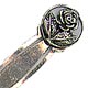 This bookmark was made in a Scandinavian country between 1920 - 1930. It is marked only 900 for 900 fine silver. The top is a circle with a figural flower within it.