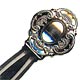 This bookmark was made in the US by Wallace Silversmiths. It is a new bookmark, made in 1998 and is marked Wallace Sterling 925. The top is a sheild with scroll work around the edges.  