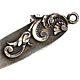 This bookmark was made in the US by an unknown manufacturer. It is marked X&S Co. Sterling on the back. This is a tiny bookmark with the top blade a floral art nouveau shape. The date is 1900 - 1910.  