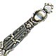 This bookmark was made in France by an unknown manufacturer. It is marked DEPOSE and CM. It is an art nouveau piece with an intricate pattern with two birds at the bottom of the top blade.  The date is 1890 - 1910.