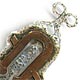 This bookmark was made in the US possibly by Gustav Stickley. It is copper and silver and is hallmarked with an unknown mark. It is hand made in the Arts and Crafts style. The date is 1910 - 1920. 