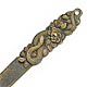 This bookmark was made in Japan between 1900 - 1910. It is a high relief figural of a snake wrapped around some flowers. It is unmarked.  
