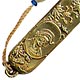 This bookmark was made in Japan. It is brass and has a medallion of a man, possibly Columbus. There are also flowers surrounding the medallion The date is 1900 - 1910.