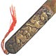 This bookmark was made in Japan. It is brass and has a high relief pictures of birds. The date is 1900 - 1910.