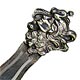 This bookmark was made in the US by an unknown manufacturer. It is silverplate over brass and depicts an art nouveau lady head with a bird and flowers. The date is 1900 - 1910.
