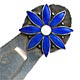 This bookmark was made in Norway. It is marked 830S with an H hallmark. The top is a figural flower with blue enamel petals and a white enamel center.  The date is 1920 - 1930.  
