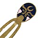 This bookmark was made in China. It is made of tin and enamel paint and has a dark blue and pink Chinese mask on top.  The date is 1960 - 1970.  