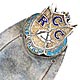 This bookmark is made in Birmingham, England. It is marked with the the date mark of 1920 and the hallmarks for Birmingham. It is silver and enamel and has the shield of the Cygnet Rowing Club. 