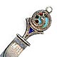 This bookmark was made in the US by an unknown manufacturer. It is marked sterling. The top has an enamel design in plique-a-jour. The date is 1900 - 1910.  
