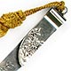 This bookmark was made in the US by Shiebler. It is marked with the makers hallmark, sterling and the number 2177. The top blade has relief flowers. The date is 1900 - 1910.