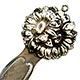 This bookmark was made in the US by an unknown manufacturer. It is marked sterling front. The top two overlapping flowers. The date is 1900 - 1910.