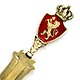 This bookmark was made in Norway by David Andersen. It is marked 925 and the makers hallmark. The top has a shield of red enamel with a lion passant and a crown on top. It is finished in a gold wash. The date is 1910 - 1920.