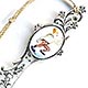  This bookmark was made in the US by an unknown manufacturer. It is marked sterling on the back. The top has an enamel picture of a clown or a monkey dressed as a clown.  The date is 1900 - 1910.   