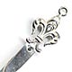  This bookmark was made in the US by an unknown manufacturer. It is marked sterling  1653 on the back. The top has fleur-de-lis and a ring which probably had a tassel at one time.  The date is 1900 - 1910.   