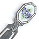  This bookmark was made in the US by an unknown manufacturer. It is marked sterling on the back. The top is an enamel picture of purple flowers framed in an octagon shaped border of sectioned pink enamel. The date is 1900 - 1910   