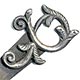  This bookmark was made in the US by an unknown manufacturer. It is marked sterling on the back. The top has an art nouveau design. There is a small blade in back. The date is 1900 - 1910.   