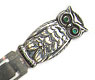 This bookmark is Swedish from the turn of the 20th century. It has two hallmarks; one is the Swedish inport mark and the other is the letter S. The top is an owl with two green glass eyes.