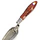  This bookmark was made in the US or Scotland. It is a masonic piece in the shape of a trowel with a faceted goldstone handle. The date is sometime in the 1950s when goldstone was very popular.   