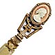  This bookmark was made in France. It is unmarked gilded brass and has a cameo on top. The date is 1890 - 1910.  