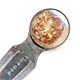 This bookmark is made in Chester, England. The manufacturer's mark is S.M. & Co. for Sampson Mordan & Co. The top contains a dried out plant with seeds. The date is 1914 - 1915.